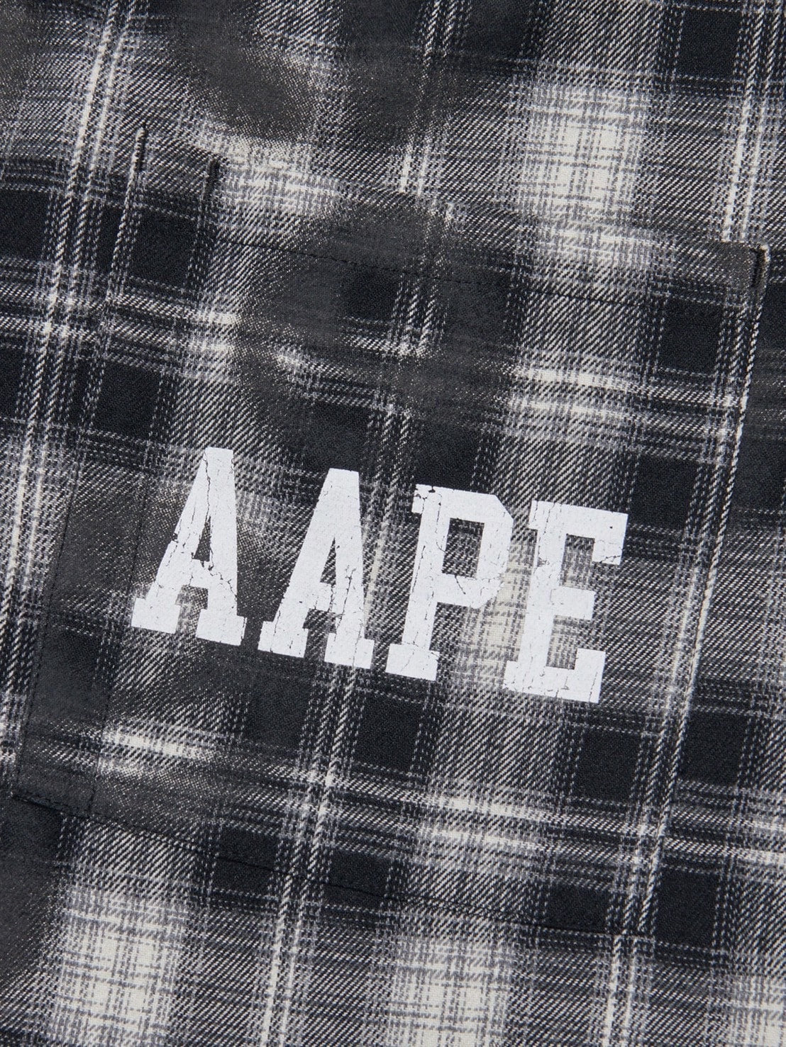 【AAPE X NOMANUAL】AAPE X NOMANUAL SPRAYED SYMBOL CHECK SHIRT