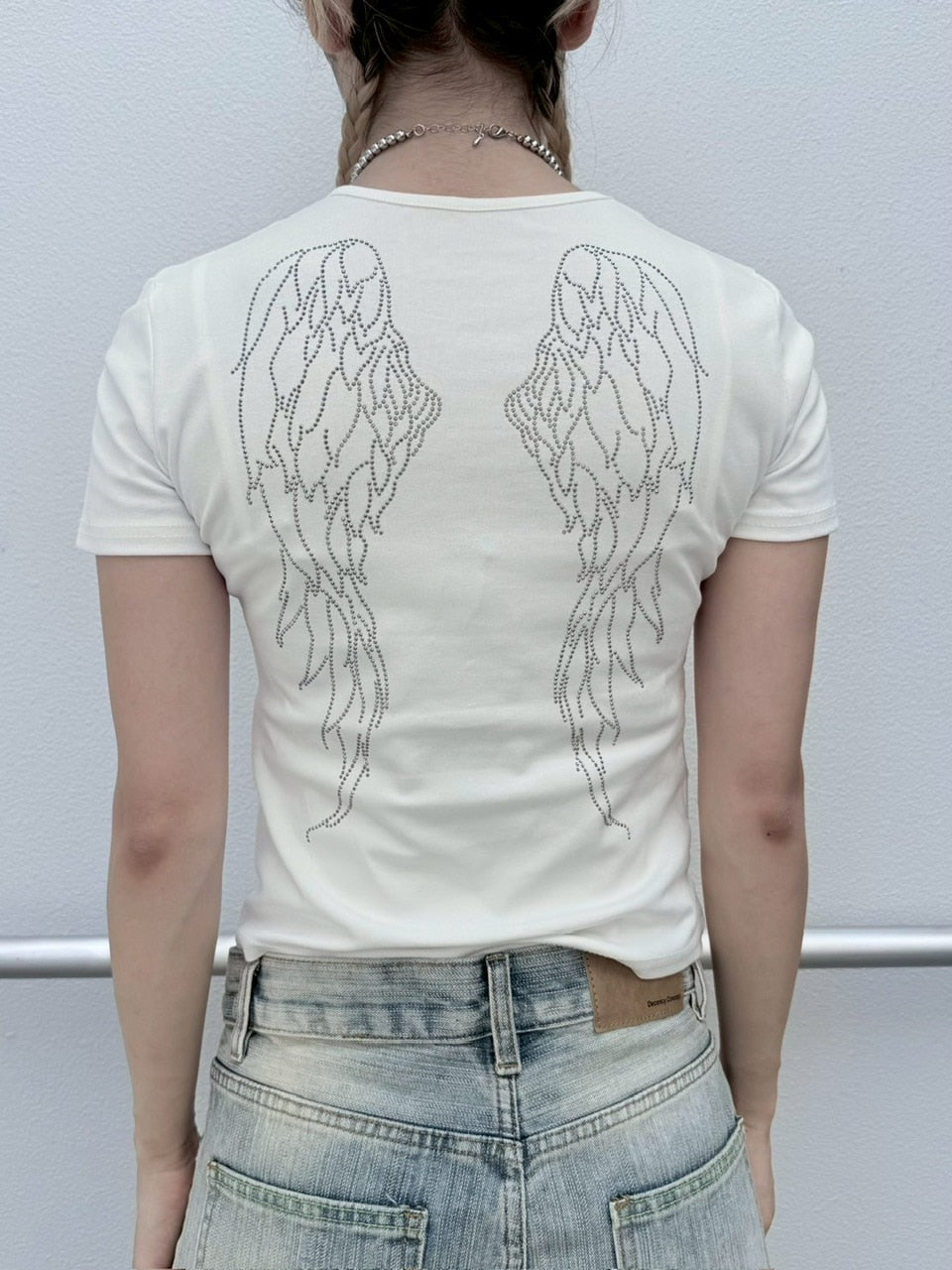 【nmtc +】feather design tee (2color) / 【エヌエムティーシープラス】フェザーデザインプリント半袖Tシャツ