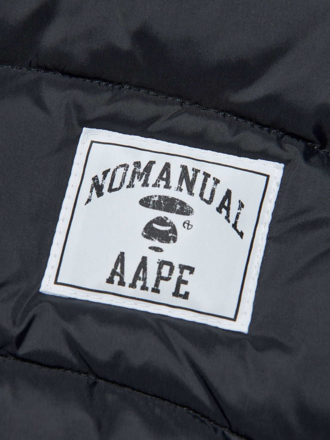 【AAPE X NOMANUAL】AAPE X NOMANUAL MOONFACE LIGHT DUCK DOWN