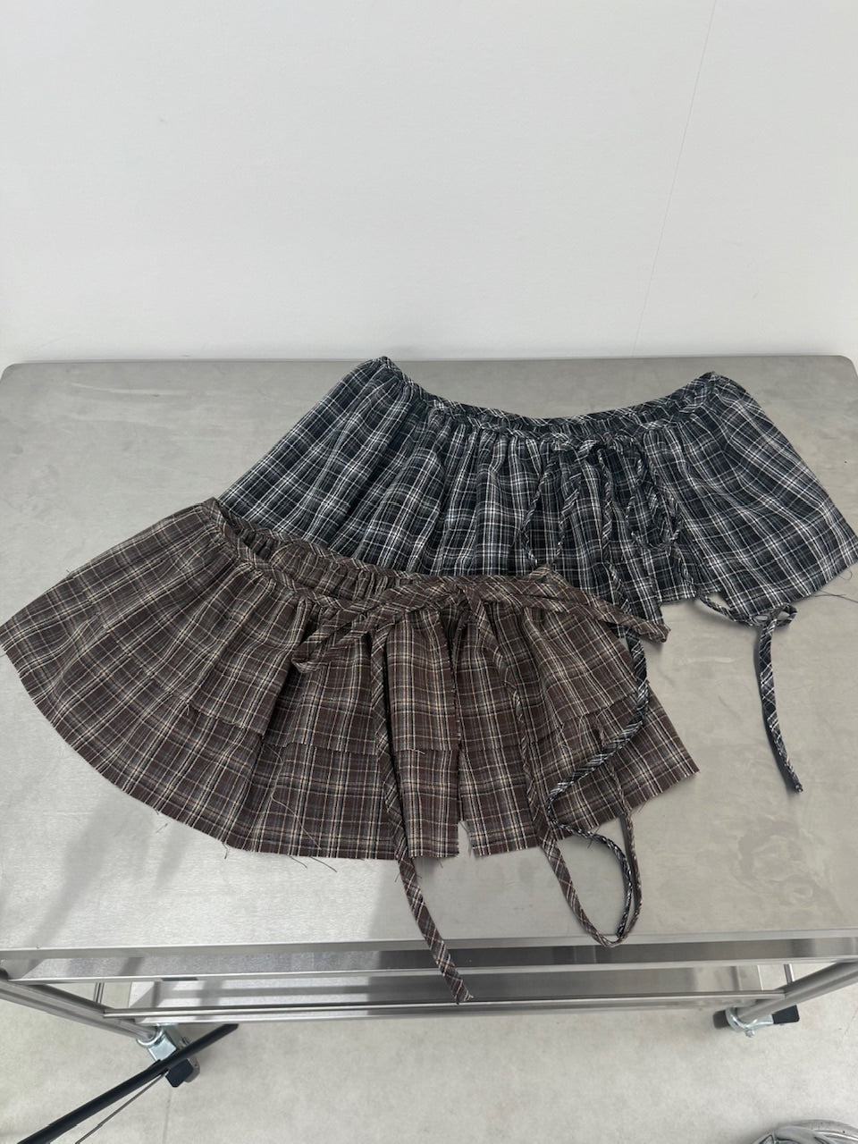 国際配送【Nerd out XU】frill check layered skirt (2color)