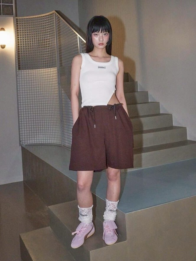 【ODDONEOUT】SIDE BUCKLE SLIT TOP