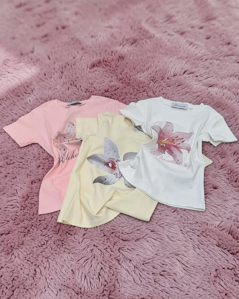 国際配送【Never mind the XU】flower rhinestone tee (3color)